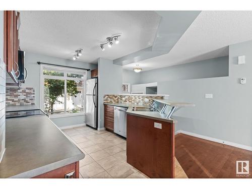 #22 1804 70 St Sw, Edmonton, AB - Indoor Photo Showing Kitchen With Double Sink