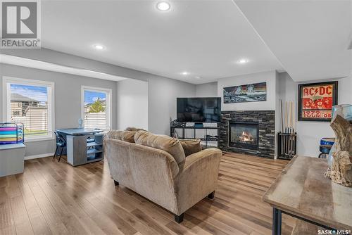 616 Thiessen Street, Warman, SK - Indoor Photo Showing Living Room With Fireplace