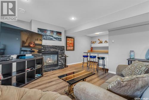 616 Thiessen Street, Warman, SK - Indoor Photo Showing Living Room With Fireplace