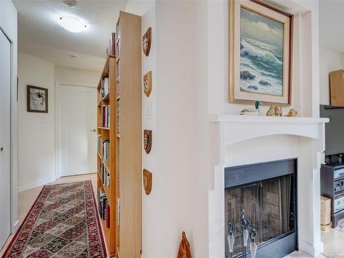 108-1436 Harrison St, Victoria, BC - Indoor Photo Showing Other Room With Fireplace