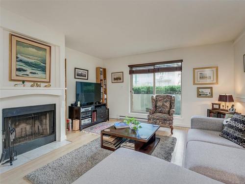 108-1436 Harrison St, Victoria, BC - Indoor Photo Showing Living Room With Fireplace