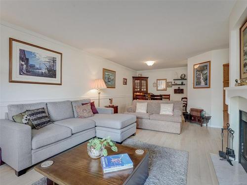 108-1436 Harrison St, Victoria, BC - Indoor Photo Showing Living Room With Fireplace