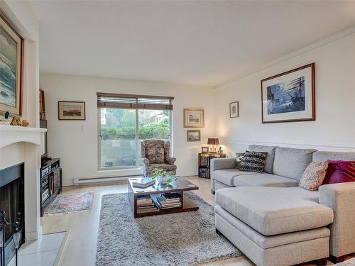 108-1436 Harrison St, Victoria, BC - Indoor Photo Showing Living Room With Fireplace