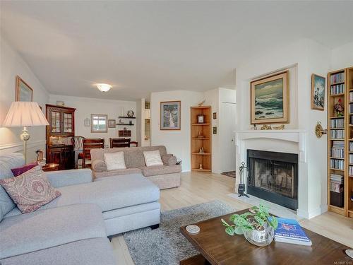 108-1436 Harrison St, Victoria, BC - Indoor Photo Showing Living Room With Fireplace