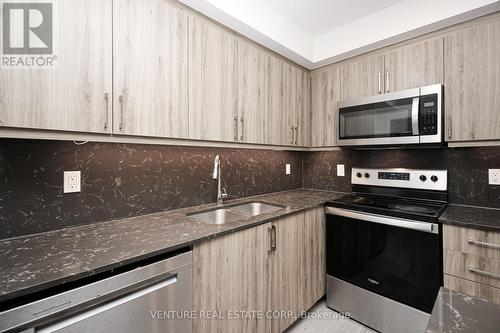 308 - 58 Lakeside Terrace, Barrie, ON - Indoor Photo Showing Kitchen With Stainless Steel Kitchen With Double Sink