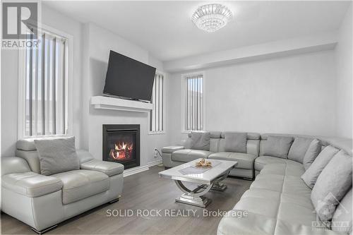 668 Decoeur Drive, Ottawa, ON - Indoor Photo Showing Living Room With Fireplace