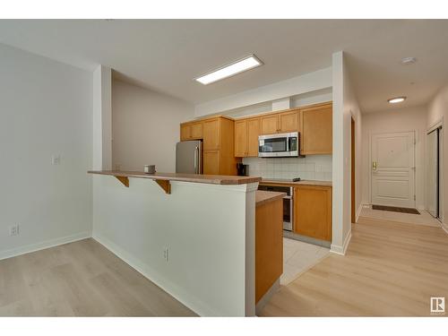 #234 10023 110 St Nw, Edmonton, AB - Indoor Photo Showing Kitchen