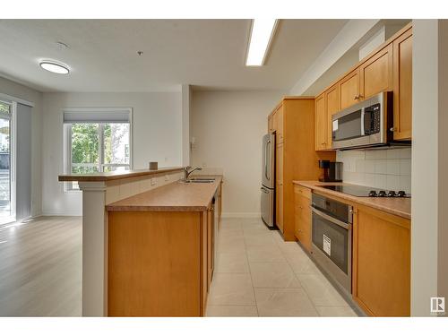 #234 10023 110 St Nw, Edmonton, AB - Indoor Photo Showing Kitchen