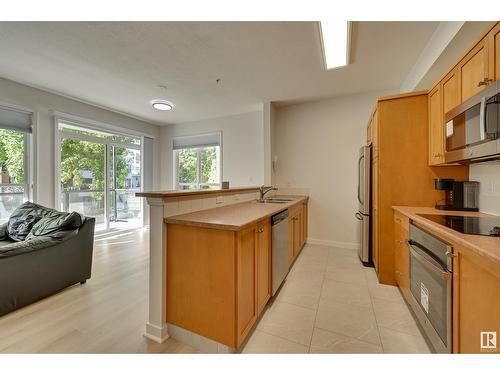 #234 10023 110 St Nw, Edmonton, AB - Indoor Photo Showing Kitchen With Double Sink