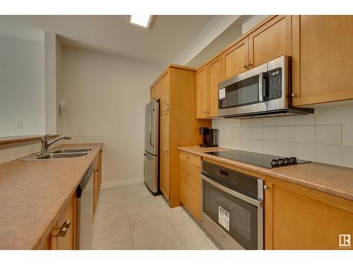 #234 10023 110 St Nw, Edmonton, AB - Indoor Photo Showing Kitchen With Stainless Steel Kitchen With Double Sink