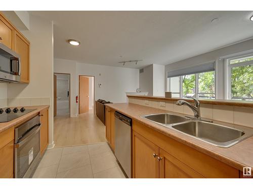 #234 10023 110 St Nw, Edmonton, AB - Indoor Photo Showing Kitchen With Double Sink