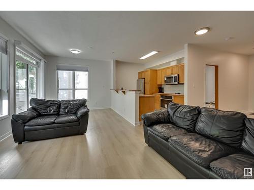 #234 10023 110 St Nw, Edmonton, AB - Indoor Photo Showing Living Room