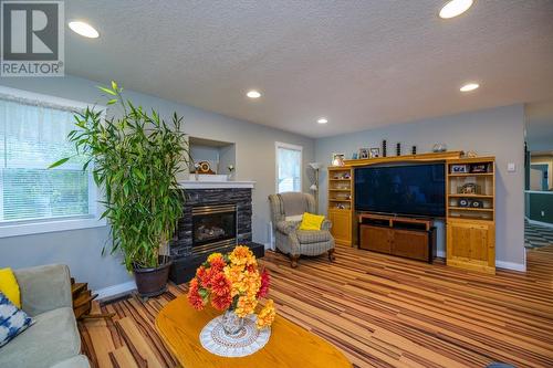 7000 Dawson Road, Prince George, BC - Indoor Photo Showing Living Room With Fireplace