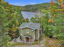 Frontage - 84 Ch. De La Source, Val-Des-Monts, QC  - Outdoor With Body Of Water 