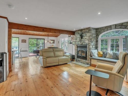 Overall view - 84 Ch. De La Source, Val-Des-Monts, QC - Indoor Photo Showing Living Room With Fireplace