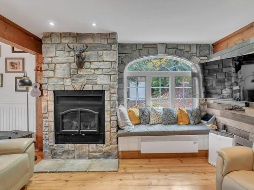 Living room - 84 Ch. De La Source, Val-Des-Monts, QC - Indoor Photo Showing Living Room With Fireplace