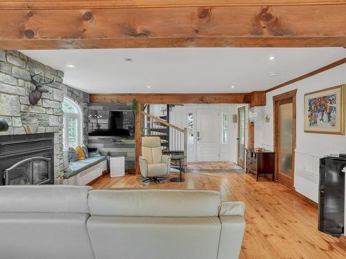 Overall view - 84 Ch. De La Source, Val-Des-Monts, QC - Indoor Photo Showing Living Room With Fireplace