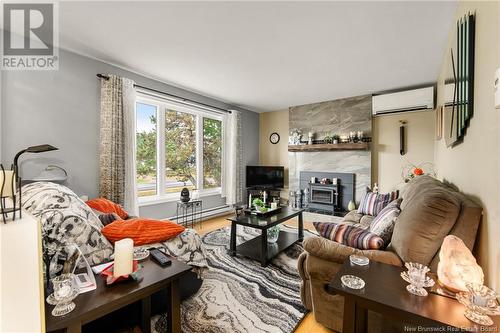 41 Route 933, Grand-Barachois, NB - Indoor Photo Showing Living Room With Fireplace