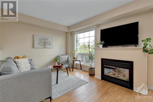 128 Cedardown Private, Ottawa, ON - Indoor Photo Showing Living Room With Fireplace