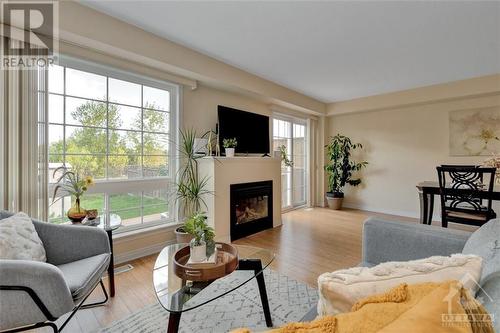 128 Cedardown Private, Ottawa, ON - Indoor Photo Showing Living Room With Fireplace