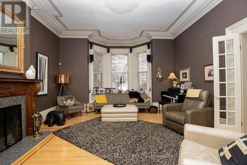 Living room / 1st level front - 554 Waterloo Street, London, ON - Indoor Photo Showing Other Room With Fireplace