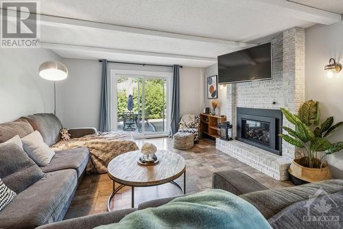 13 Ridgeburn Gate, Ottawa, ON - Indoor Photo Showing Living Room With Fireplace