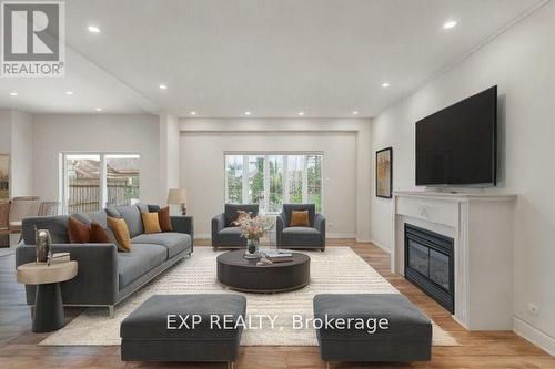 1002 Vickerman Way, Milton, ON - Indoor Photo Showing Living Room With Fireplace