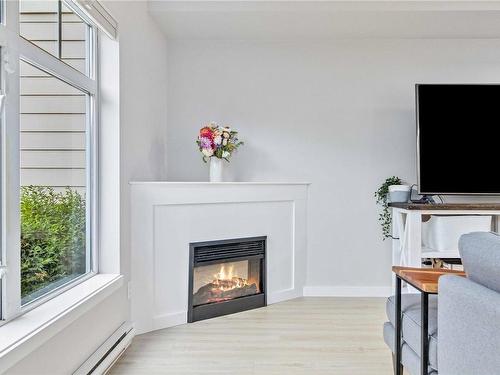 101-7088 West Saanich Rd, Central Saanich, BC - Indoor Photo Showing Living Room With Fireplace