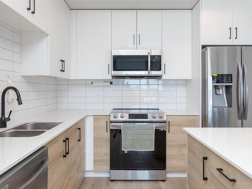 402-2465 Gateway Rd, Langford, BC - Indoor Photo Showing Kitchen With Stainless Steel Kitchen With Double Sink With Upgraded Kitchen