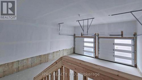 22 Sassafras Road, Springwater, ON - Indoor Photo Showing Garage