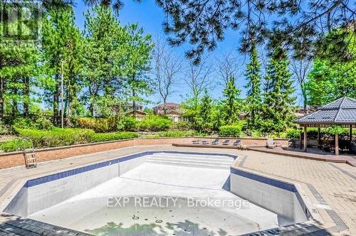 802 - 100 County Court Boulevard, Brampton, ON - Outdoor With In Ground Pool With Backyard