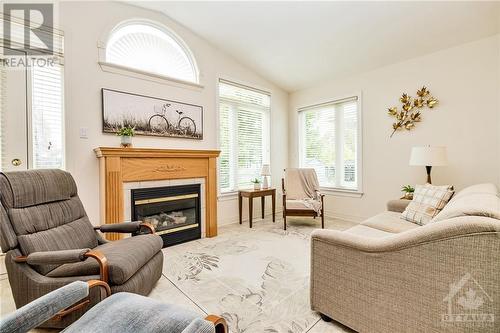 8 Nighthawk Crescent, Ottawa, ON - Indoor Photo Showing Living Room With Fireplace