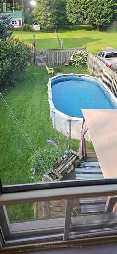 110 Smith Street, Wellington North, ON - Outdoor With Above Ground Pool With Backyard