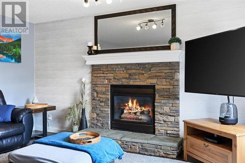 133 Prestwick Mews Se, Calgary, AB - Indoor Photo Showing Living Room With Fireplace