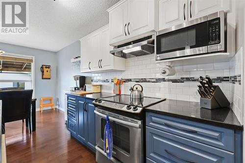 133 Prestwick Mews Se, Calgary, AB - Indoor Photo Showing Kitchen With Stainless Steel Kitchen With Upgraded Kitchen