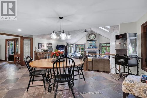 9941 Nipigon Street, Lambton Shores (Port Franks), ON - Indoor Photo Showing Dining Room With Fireplace