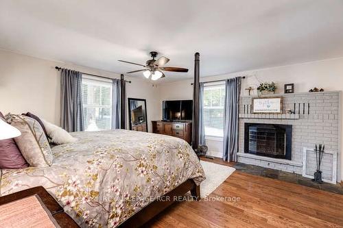 1309 Adjala Tecumseth Line, New Tecumseth, ON - Indoor Photo Showing Bedroom With Fireplace