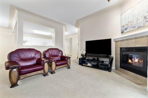 106-1964 Enterprise Way, Kelowna, BC - Indoor Photo Showing Living Room With Fireplace