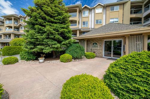 106-1964 Enterprise Way, Kelowna, BC - Outdoor With Balcony With Facade