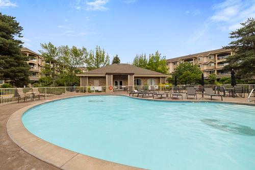 106-1964 Enterprise Way, Kelowna, BC - Outdoor With In Ground Pool With Backyard