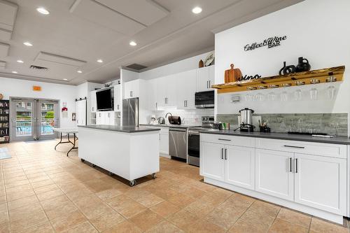 106-1964 Enterprise Way, Kelowna, BC - Indoor Photo Showing Kitchen With Upgraded Kitchen