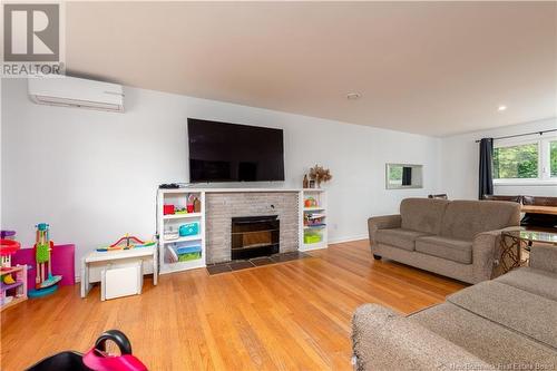 55 Poirier, Moncton, NB - Indoor Photo Showing Living Room With Fireplace