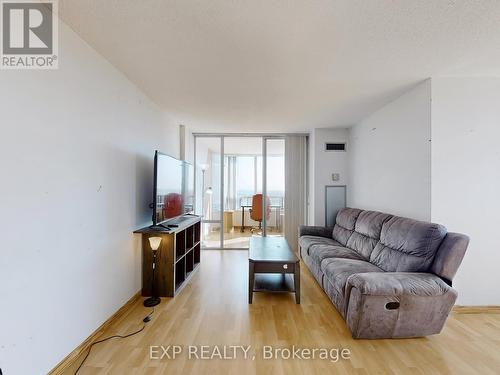 1210 - 350 Alton Towers Circle, Toronto, ON - Indoor Photo Showing Living Room