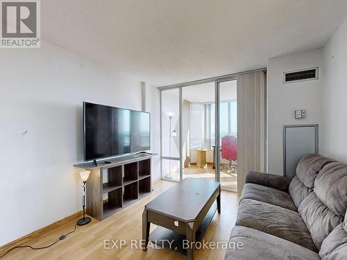 1210 - 350 Alton Towers Circle, Toronto, ON - Indoor Photo Showing Living Room