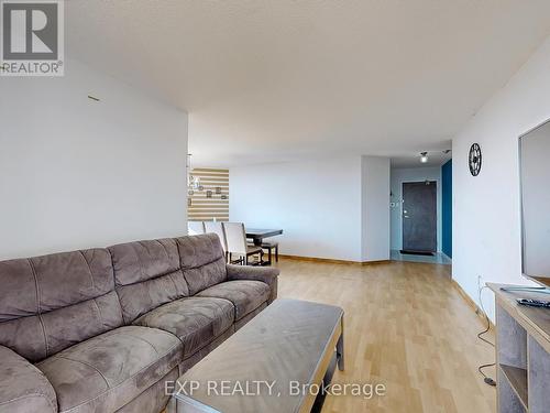 1210 - 350 Alton Towers Circle, Toronto, ON - Indoor Photo Showing Living Room