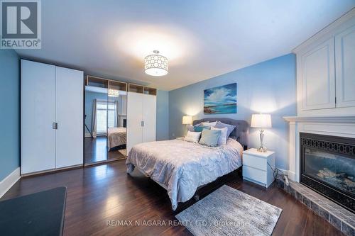 63 Rodman Street, St. Catharines, ON - Indoor Photo Showing Bedroom With Fireplace