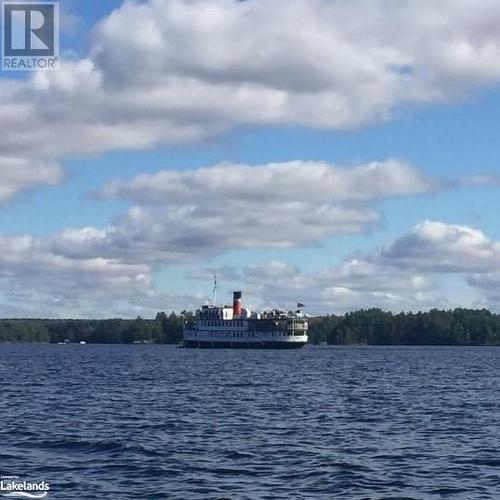 Watch the Muskoka Steamships leaving the Wharf - 1005 Road 3300, Gravenhurst, ON - Outdoor With Body Of Water With View