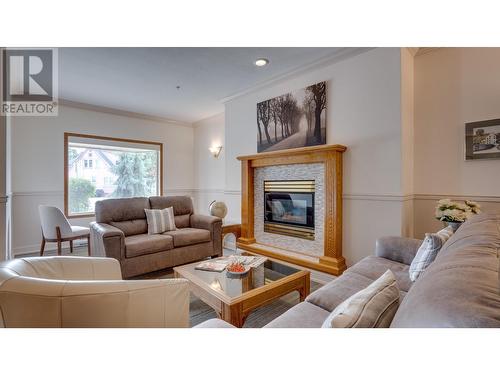 3805 30 Avenue Unit# 409, Vernon, BC - Indoor Photo Showing Living Room With Fireplace