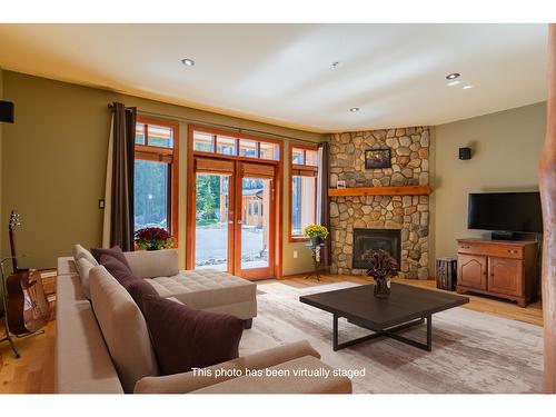 5 - 1008 Olaus Way, Rossland, BC - Indoor Photo Showing Living Room With Fireplace