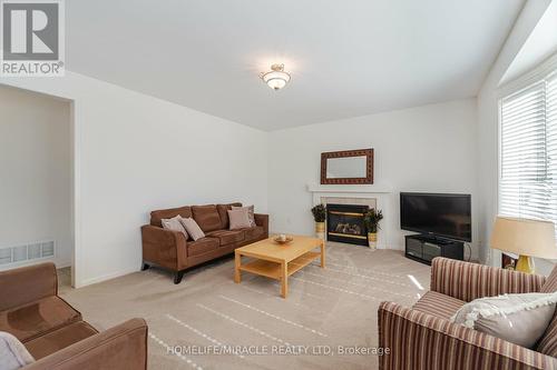 5 Valleywest Road, Brampton, ON - Indoor Photo Showing Living Room With Fireplace